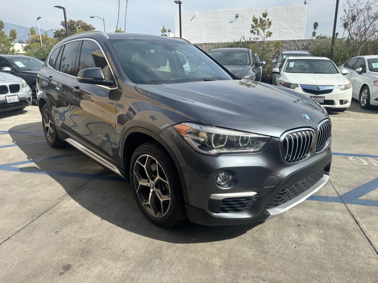 2016 Gray /Black BMW X1 leather (WBXHT3Z34G4) with an 4 CYLINDER engine, Automatic transmission, located at 30 S. Berkeley Avenue, Pasadena, CA, 91107, (626) 248-7567, 34.145447, -118.109398 - Crown City Motors is a used “Buy Here Pay Here” car dealer in Pasadena CA. “Buy Here Pay Here” financing, means that when you purchase your vehicle from our dealership, that you make the payments to the dealership as well. We do not need the banks approval to get you approved for a used auto - Photo#7